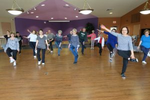 Adults dancing during a fitness class with Leisure Unlimited.